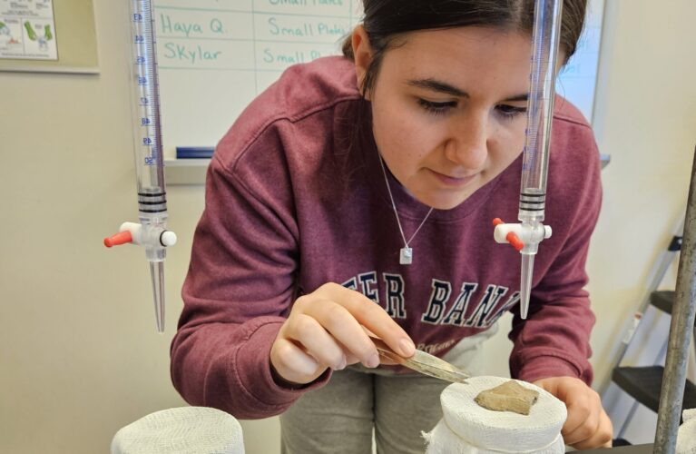 student tests rock in lab
